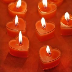 many small candles in the shape of hearts