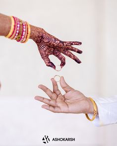 two people reaching out their hands to touch each other