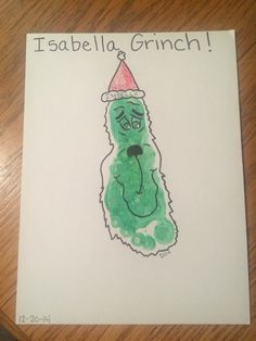 a drawing of a green monster wearing a santa hat