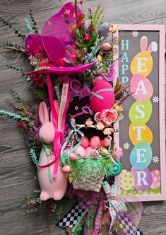 an assortment of easter decorations on display next to a happy easter sign and greeting card