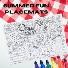 the summer fun placemats with markers and crayons next to it on a checkered table cloth