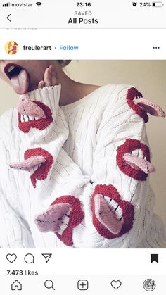 a woman with her tongue sticking out and wearing knitted sweaters that have lips on them