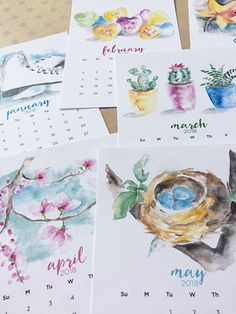 four calendars with watercolor drawings of birds and flowers on them, each featuring a bird's nest