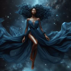 a woman in a blue dress flying through the air with her hair blowing in the wind