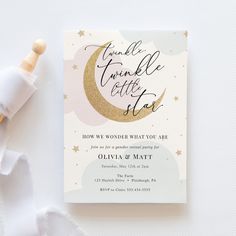 a white and gold wedding card with the words twinkle little star on it next to a toothbrush