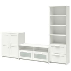 a white bookcase with drawers and cabinets next to each other on a white background