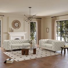 a living room with two couches and a coffee table in front of large windows