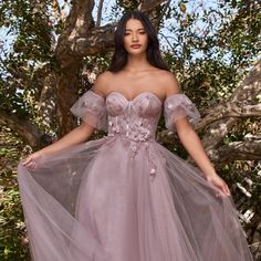 The Cute Dress Made Of Delicate Tulle Has A Structural Corset With Underwire That Is Decorated With A Small Number Of Floral Appliques. Removable Puff Sleeves Will Make Your Look Unique, While An Inconspicuous Zipper On The Back Will Ensure A Secure Fixation Of The Dress. Fabric: Tulle Length: Long Colour: Mauve Neckline: Off Shoulder Silhouette: Ball Gown Sleeve: Removable Puff Sleeves Back: Semi-Open, Zipper Skirt: Layered Embellishments: Floral Applique Occasion: Romantic Date/Evening/Dinner, Off The Shoulder Princess Dress, Purple Wedding Dress The Bride Lavender, Tulle Dresses With Detachable Train, Bridesmaid Dress With Detachable Train And Floor-length, Fitted Tulle Ball Gown For Mother Of The Bride, Fitted Tulle Mother Of The Bride Ball Gown, Bridesmaid Gown With Fitted Bodice And Tulle Material, Organza Gown With Fitted Bodice For Bridesmaid, Bridesmaid Dress With Detachable Train And Sweetheart Neckline