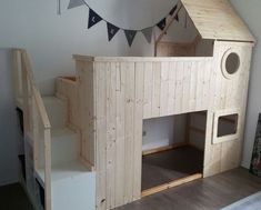 a child's room with a wooden bunk bed and stairs