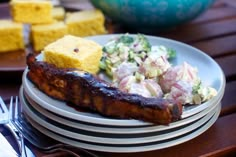 there is a plate with food on it next to other plates and utensils