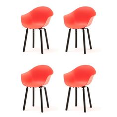 four red chairs sitting next to each other on top of a white surface with black legs