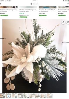 a white flower arrangement in a glass vase