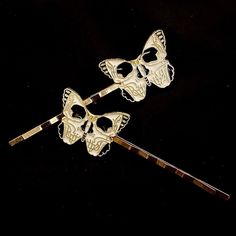 "Pieces are attached using a special jewelry adhesive. Please read descriptions thoroughly for sizes and materials.  This is a set of 2 gold metal hair pins featuring gold metal moths or butterflies with skulls on them, with black and white enamel. Each one goes in a different direction, so you can wear them on either side of your head, and are mounted on silver hair pins. Each pin is 2 1/2\" long, and 1\" wide. Make sure to check out my shop for more hair pins, jewelry, accessories, and all sor Skull Hair Pin, Butterfly Hair Pin, Silver Hair Pins, Skull Moth, Butterfly Skull, Skull Butterfly, Silver Hair Pin, Metal Hair, Bobby Pin