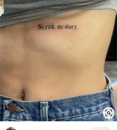 a woman's stomach with the words, worst no story tattooed on her side