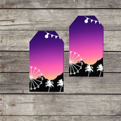 two tags with palm trees and ferris wheel on them, against a wooden background that has planks