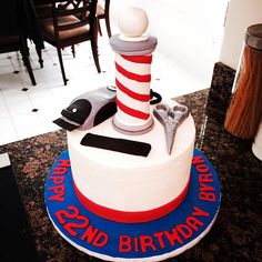 a birthday cake with a lighthouse on top