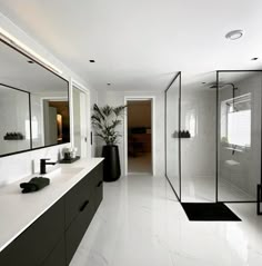 a large bathroom with white walls and flooring