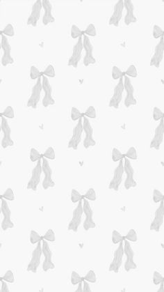 a white wallpaper with bows and hearts in the middle, on a light gray background