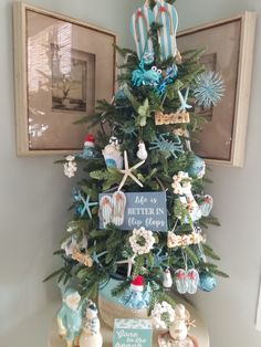 a small christmas tree with decorations on it