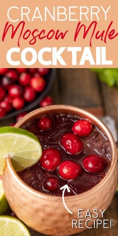 cranberry moscow mule cocktail in a copper bowl with limes and cherries