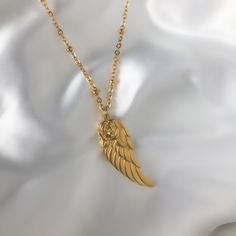 This charming Necklace features a brilliant golden wing pendant with a delicate Rose on top. This beautiful gold pendant is center stage to our luminous Satellite Chain that its on. Wear it to remind yourself you have wings and are meant to soar high. ♡︎ 𝘼 𝙥𝙤𝙧𝙩𝙞𝙤𝙣 𝙤𝙛 𝙥𝙧𝙤𝙛𝙞𝙩𝙨 𝙛𝙧𝙤𝙢 𝙚𝙫𝙚𝙧𝙮 𝙤𝙧𝙙𝙚𝙧 𝙞𝙨 𝙙𝙤𝙣𝙖𝙩𝙚𝙙 𝙩𝙤 𝙒𝙤𝙢𝙚𝙣 𝙞𝙣 𝙣𝙚𝙚𝙙 ♡︎ ꕥ 𝗢𝗨𝗥 𝗝𝗘𝗪𝗘𝗟𝗥𝗬 𝗜𝗦 ꕥ * High Quality * Handmade * Waterproof  * 100% Lead & Nickel Free  * Won't tarnish or discolour * Hypoallergenic * Recyclable ꕥ 𝗠𝗔𝗧𝗘𝗥𝗜𝗔𝗟𝗦 ꕥ * 18K Gold Plated PVD Stainless Steel * 2 inch Pendant * 2.5mm Satellite Chain ꕥ 𝗣𝗔𝗖𝗞𝗔𝗚𝗜𝗡𝗚 ꕥ * Every piece comes in their own little bag with a jewelry card. * 100% Recyclable Packaging ♺ ꕥ 𝗢𝗥𝗗𝗘𝗥 𝗧𝗜𝗠𝗘𝗦 ꕥ * Orders are shipped Rose Necklace Gold, Beautiful Gold Pendants, Gold Rose Necklace, Angel Wings Necklace, Double Horn Necklace, Wings Necklace, Virgin Mary Necklace, Gold Wing, Angel Wing Necklace