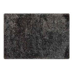 a black shaggy rug on a white background