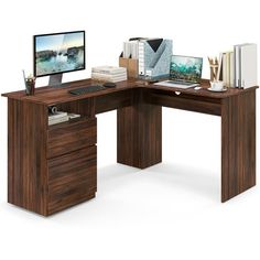 a computer desk with a monitor, keyboard and mouse on it in front of a white background