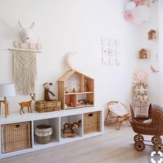 a room with white walls and shelves filled with toys