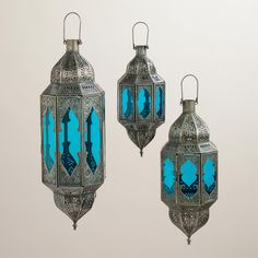 three blue lanterns hanging from the ceiling