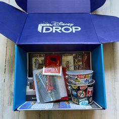 the inside of a blue box with various items in it