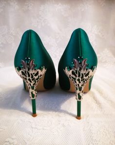 Step into elegance and sophistication with these stunning Emerald Green Satin Shoes. Perfect for a Gothic Wedding or as bridesmaid shoes, these heels are designed to make a statement. The rich emerald green color of the satin fabric exudes luxury, while the sleek design adds a touch of femininity. With a comfortable heel height, these shoes offer both style and functionality. Whether you're celebrating your big day or attending a special event, these Emerald Green Satin Shoes will surely turn heads and make you feel like a true fashionista. Specifications: 1.Heel Height: 9cm 2.Closure Type: slip-on 3.Colour: emerald green.Please do not that the colour isn't forest green,military green or bottle green. These shoes can be ordered with or without clutch. Fit: 1) If your feet are narrow and th Elegant Green Heels With 4-inch Heel, Green Heels For Gala, Glamorous Green Heels With Closed Toe, Glamorous Green Closed Toe Heels, Glamorous Green Heels For Evening, Green Almond Toe Heels For Formal Occasions, Elegant Green Heels For Party, Elegant Green Evening Heels, Elegant Green Heels For Evening