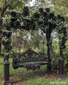 an iron bench covered in black roses and vines with the words attic hamming on it