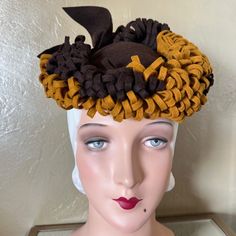 This Is Indeed A Rare And Unique Tilt Hat From The 1930s'! The Small Round Cap Is Made Of Chocolate Brown Felt, And Is Surrounded By Curled Strips Of The Same Brown Felt, Plus Curled Strips Of Gold/Mustard Colored Strips. There Is Also A Large Brown Bow At The Back, Plus An "O" Ring To Hole This Beautiful Hat In Place. Tilt Hats Were Popular In The 1930s And 1940s. They Were Worn At An Angle And Held To The Back Of The Head By A Strap, Rigid Ring, Elastic Band Beneath The Hair, Or A Combination 30s Fashion, Back Of The Head, Beautiful Hats, Brown Orange, Fashion History, Hats Vintage, O Ring, Brown Gold, Chocolate Brown