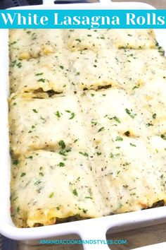 white lasagna rolls in a casserole dish with cheese and parsley