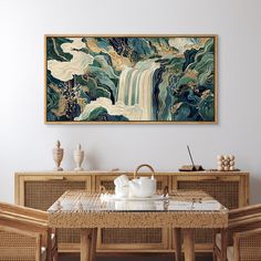 a painting hanging on the wall above a dining room table