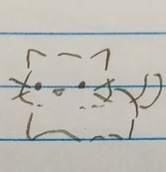 a drawing of a cat's face is shown in the middle of a piece of paper