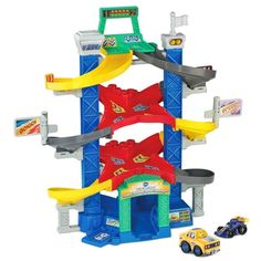 a toy car playset with cars and ramps on the top of it, including a ramp