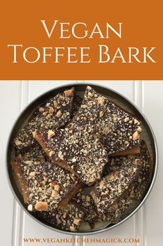 vegan toffe bark in a pan with nuts on top and the words vegan toffe bark above it