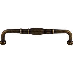 an antique brass handle on a white background