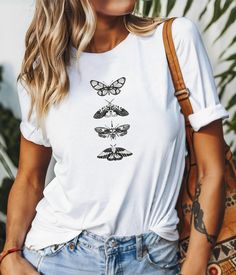 This retro simple butterfly design unisex t-shirt gives off a vintage vibe, perfect for casual everyday wear or as a statement piece. Ideal for those who love minimalist and nostalgic designs. Great for spring and summer outfitting, as well as nature lovers and fashion enthusiasts. Suitable for casual outings, picnics, or nature walks. Product features - 100% Airlume combed and ring-spun cotton fabric - Retail fit for casual and semi-formal settings - Manufactured in the US and internationally in a sustainable way - Tear-away label for minimized skin irritations - Variety of fabric blends available for different color options Care instructions - Machine wash: cold (max 30C or 90F) - Non-chlorine: bleach as needed - Tumble dry: low heat - Iron, steam or dry: medium heat - Do not dryclean Simple Butterfly Design, Tee Outfits, Simple Butterfly, Retro Minimalist, Butterfly Top, Vintage Vibe, Walking In Nature, Butterfly Design