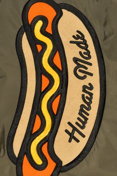 an embroidered hot dog patch on a jacket