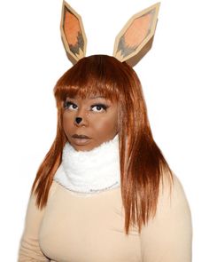 Eevee from Pokémon is one of tbe cutest and easiest looks you can do. Pull out that brown monochrome outfit, a white faux fur scarf (or scrap fabric) and DIY the ears - done! #eevee #halloweencostumeideas #easymakeupideas Eevee Makeup, Eeveelutions Cosplay, Eevee Cosplay, Brown Monochrome Outfit, Brown Monochrome, Faux Fur Scarf