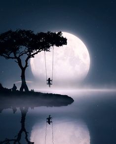 a person sitting on a swing in front of a tree with the moon behind them