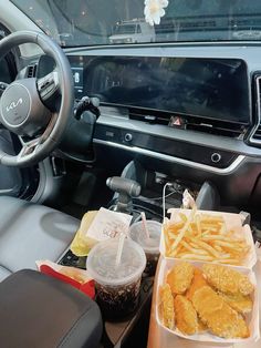 the interior of a car with food in plastic containers