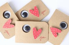 four valentine's day gift tags with eyeballs and hearts on them that say i love you