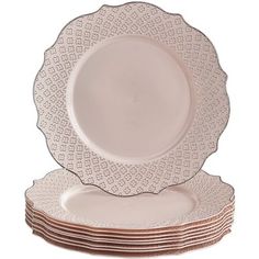 a stack of white plates sitting on top of each other