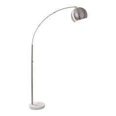 a white floor lamp with a silver shade