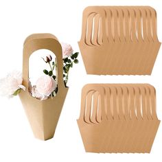 two vases with flowers in them sitting next to each other on a white background