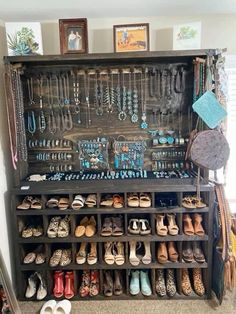 an old wooden cabinet filled with lots of jewelry