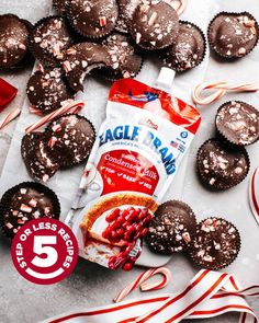 a bag of eagle brand chocolates next to some candy canes and candies